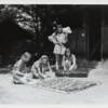 Practice making the perfect bedroll. c1936 Margy Hall photos